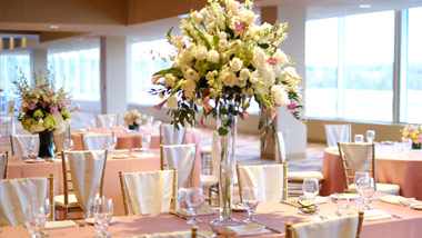large floral centerpiece in table setting