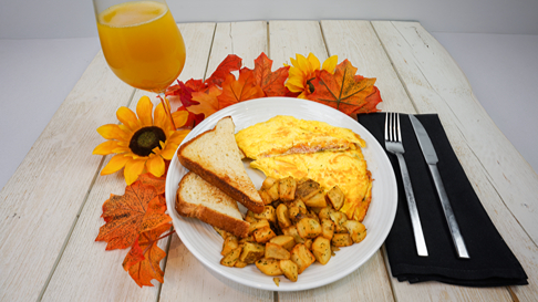 Omelet on table with mimosa