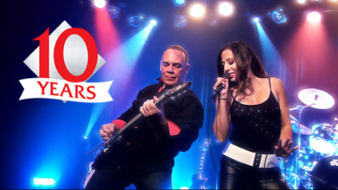 band performing with logo that says 10 years
