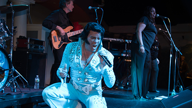 Elvis tribute band performing on stage