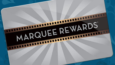 A player inserts a Marquee Rewards card into a gaming terminal.